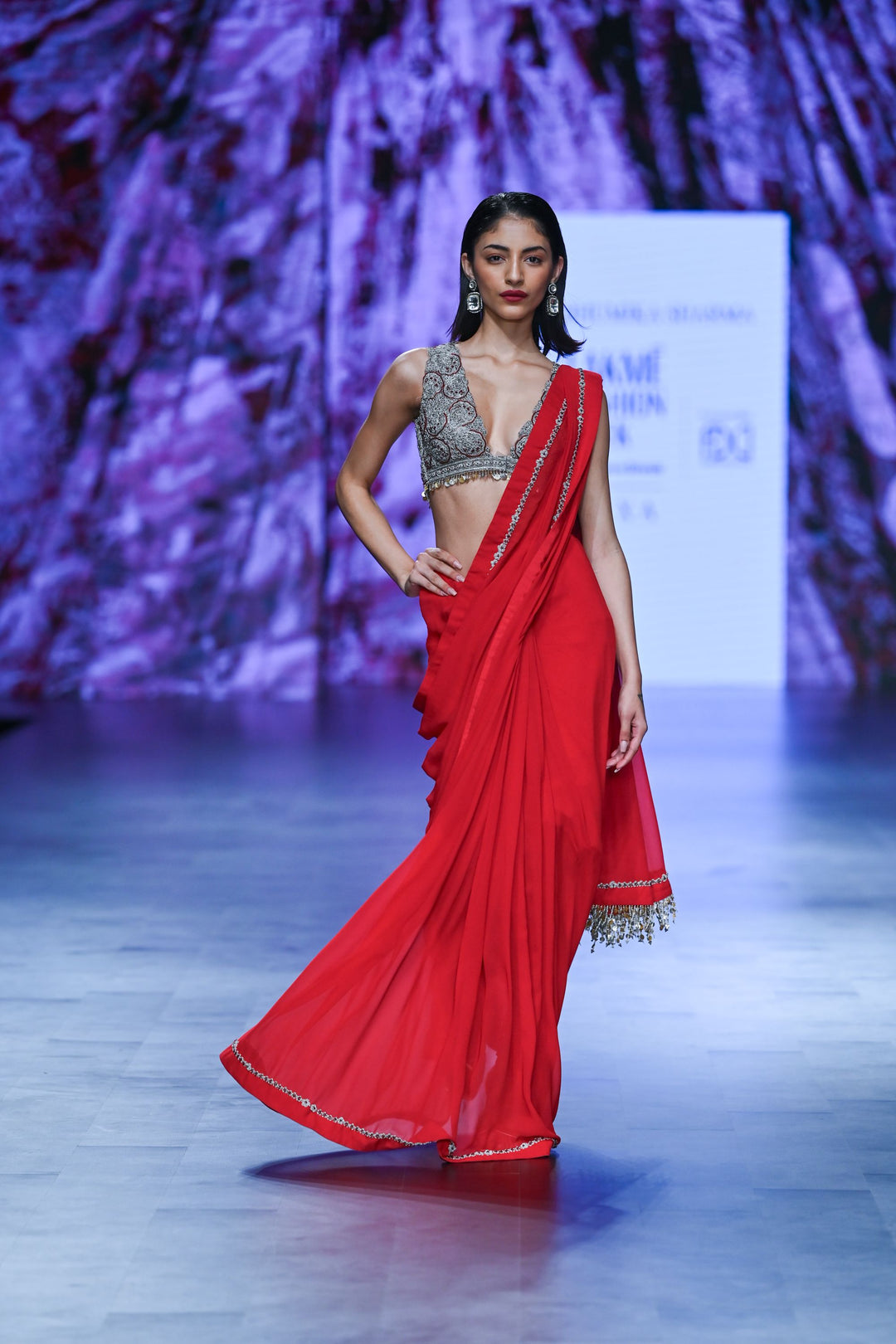 Red Saree with Embroidered Sleeveless Blouse