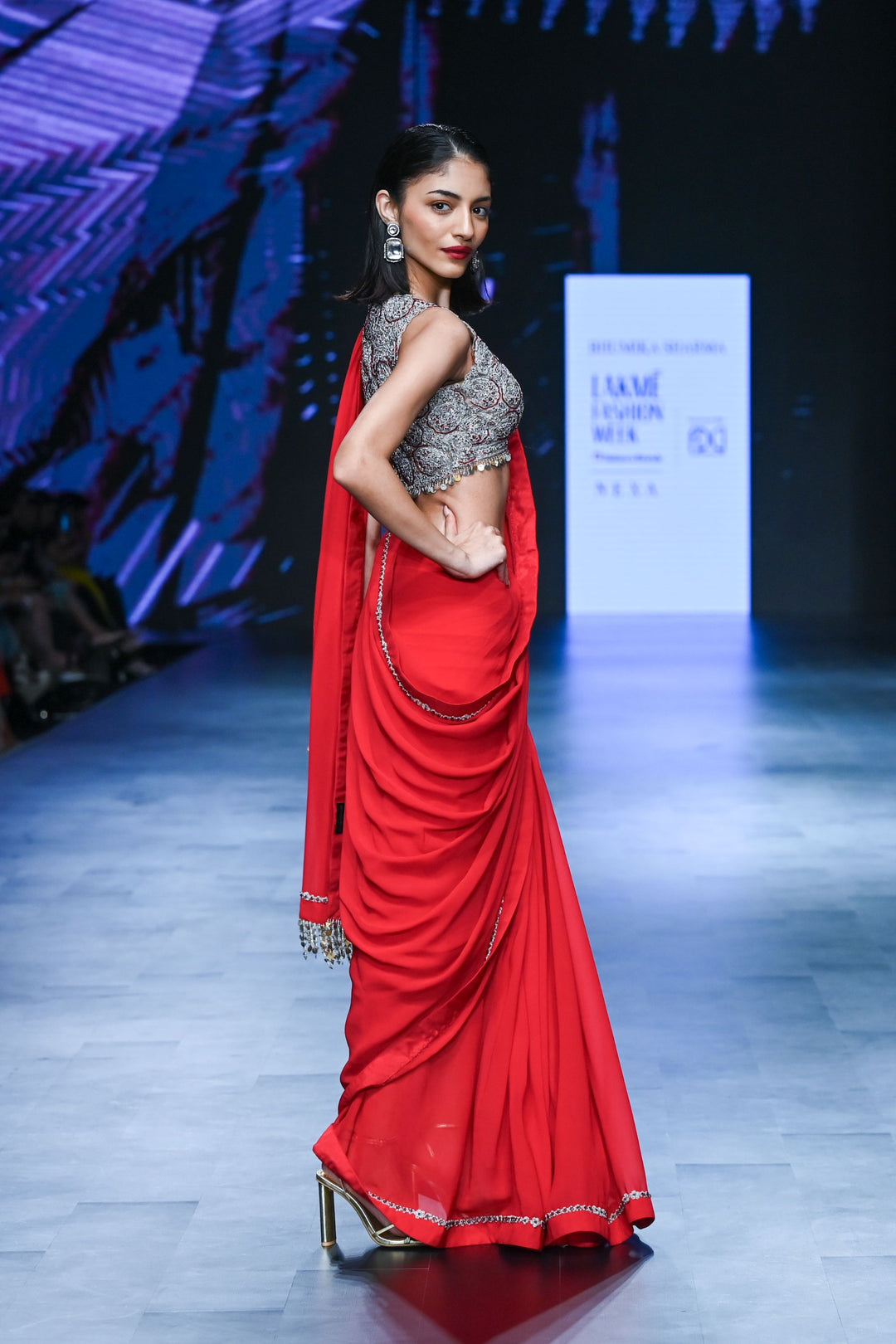 Red Saree with Embroidered Sleeveless Blouse