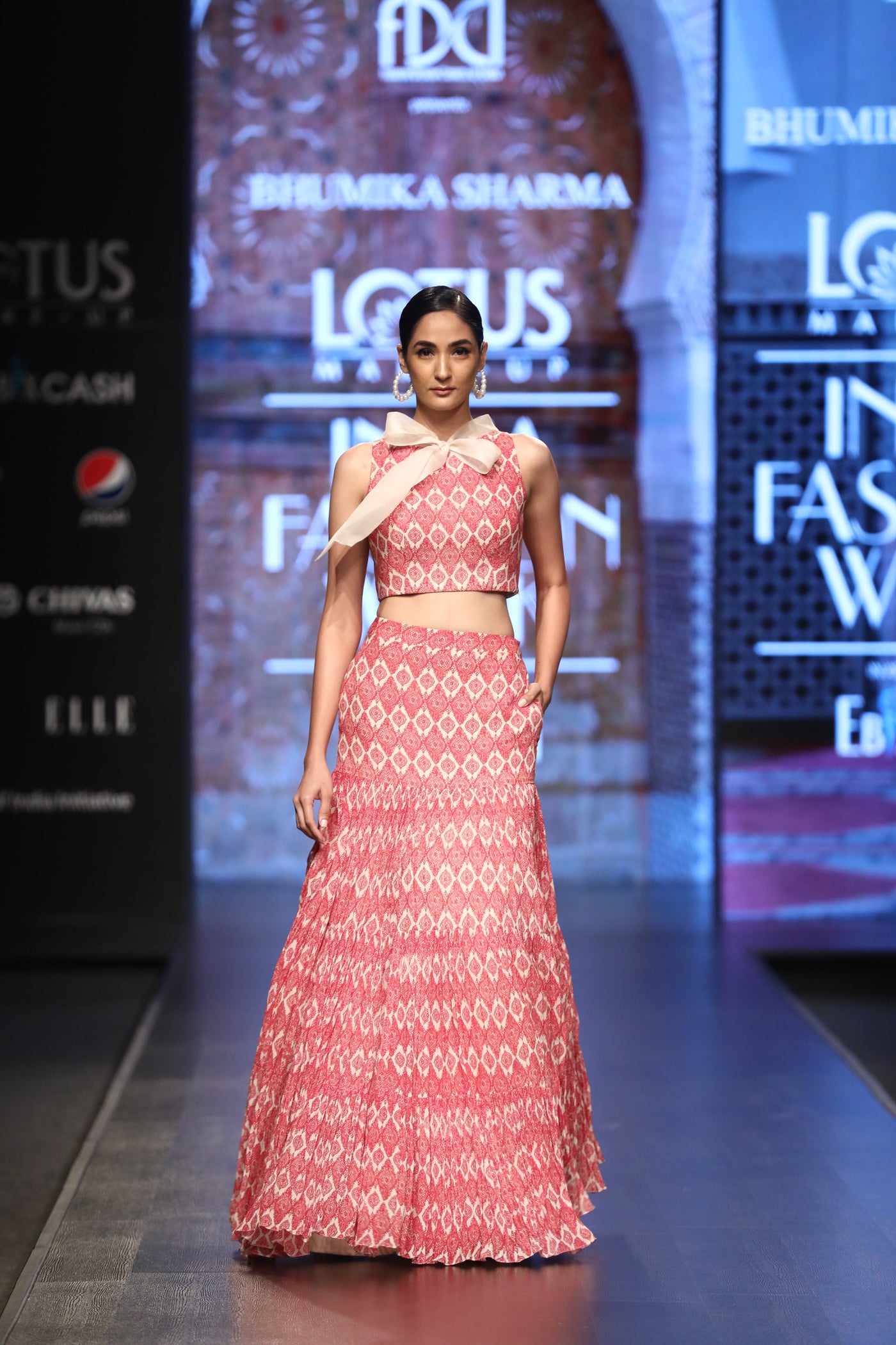 A Printed Crop Top With An Organza Bow Neck & A Printed Pleated Skirt - BHUMIKA SHARMA