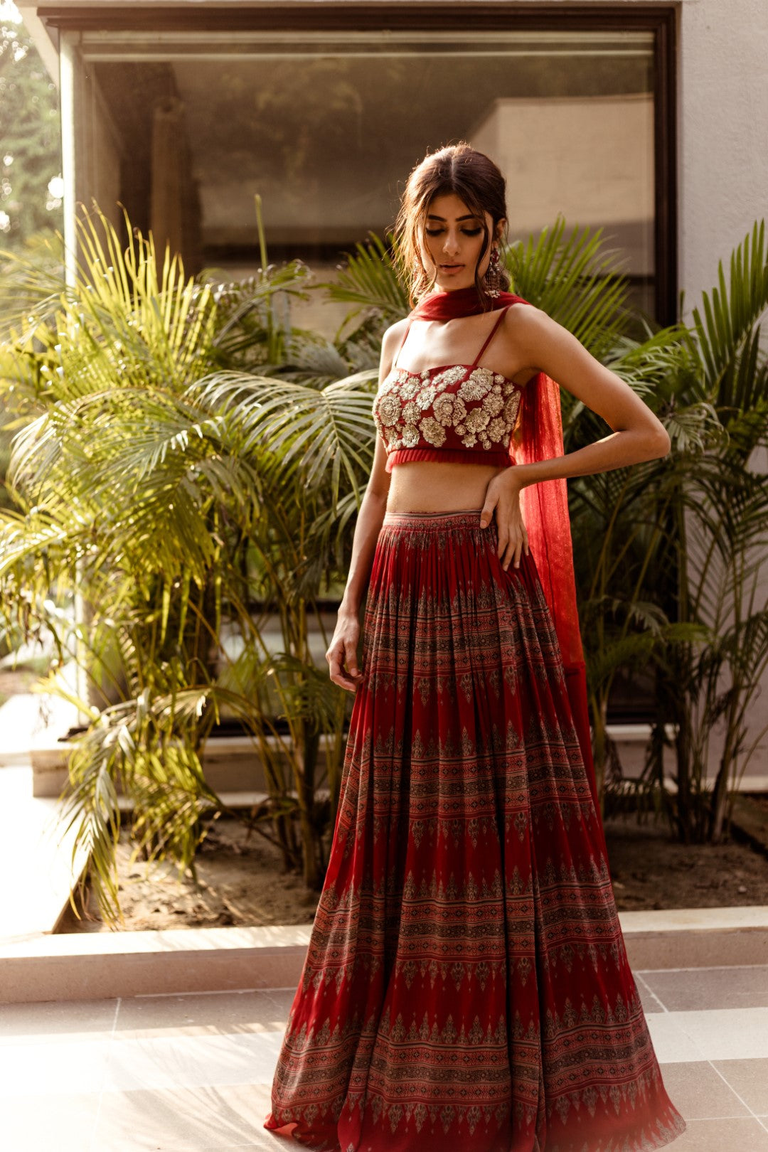 Red embellished bustier with Geometric print pleated skirt - BHUMIKA SHARMA